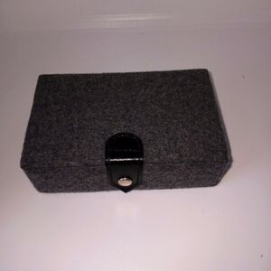 Mini gray jewelry box with snap button closure